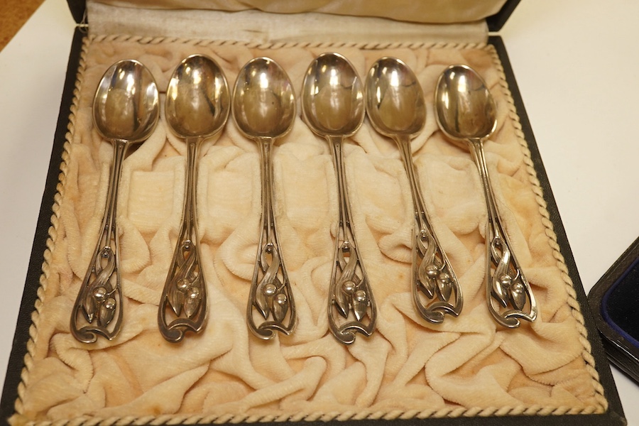 A French 800 standard white metal taste vin, 11cm, together with a George III silver toddy ladle, London, 1799, a cased set of six Art Nouveau silver coffee spoons by William Hutton & Sons and two incomplete cased silver